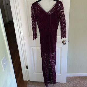 Burgundy lace column gown with v-neckline and long sleeves. Size 6.